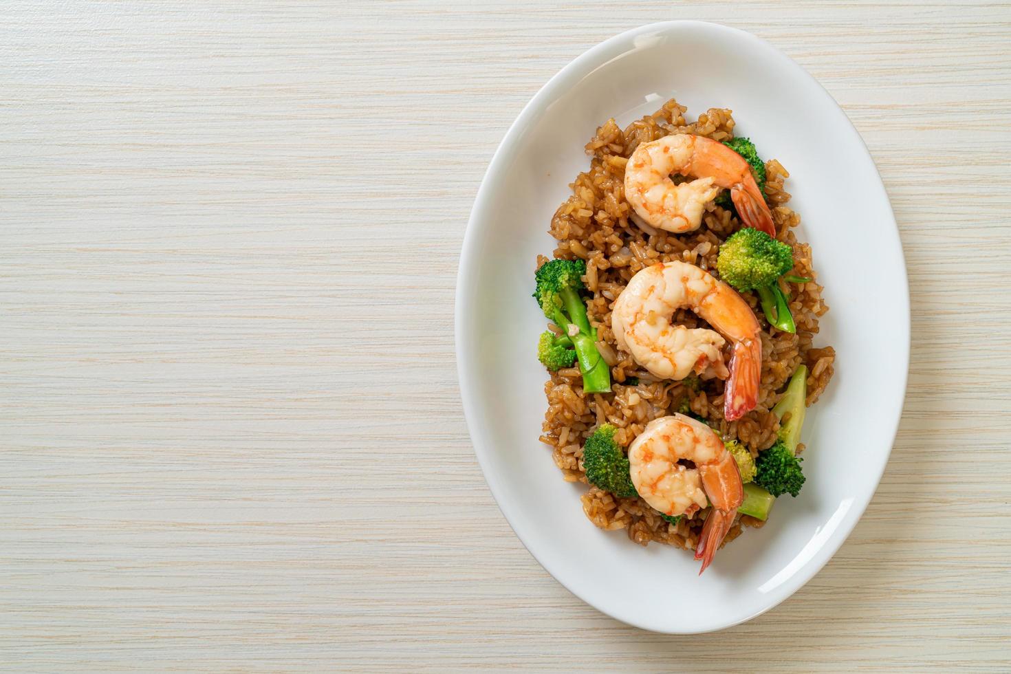 Fried rice with broccoli and shrimps photo