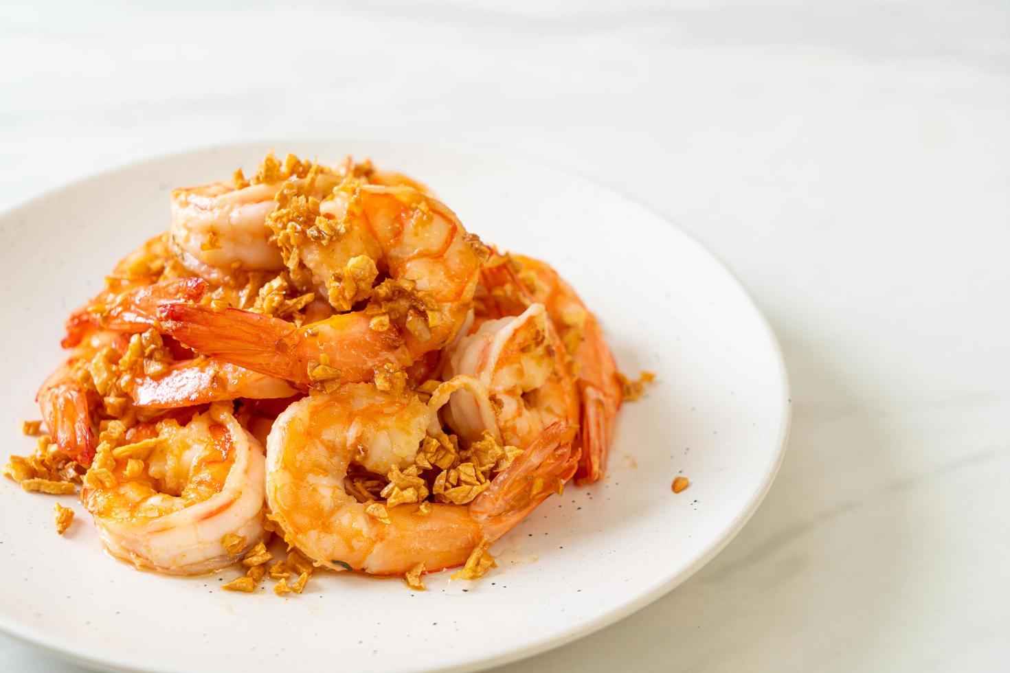 Fried shrimps or prawns with garlic photo