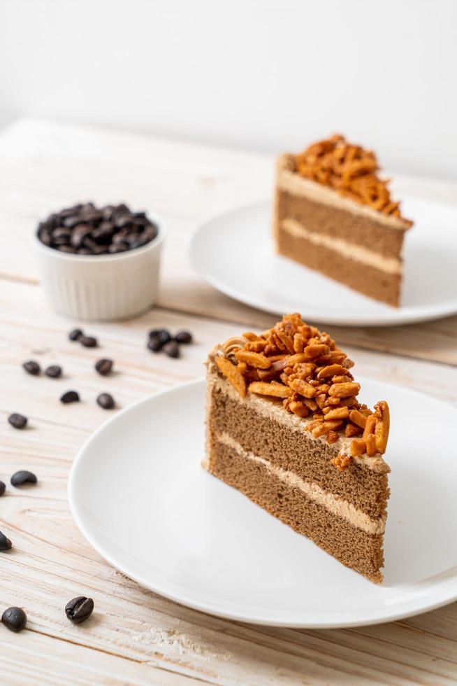 Coffee almonds cake on plate photo