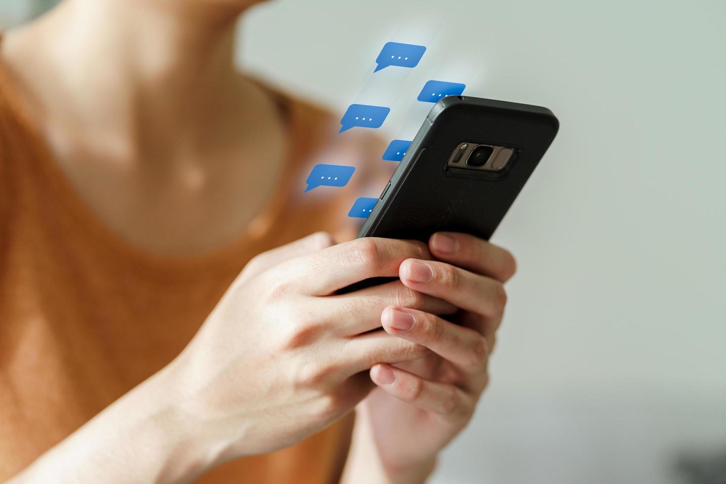 Woman using smartphone typing, chatting conversation photo