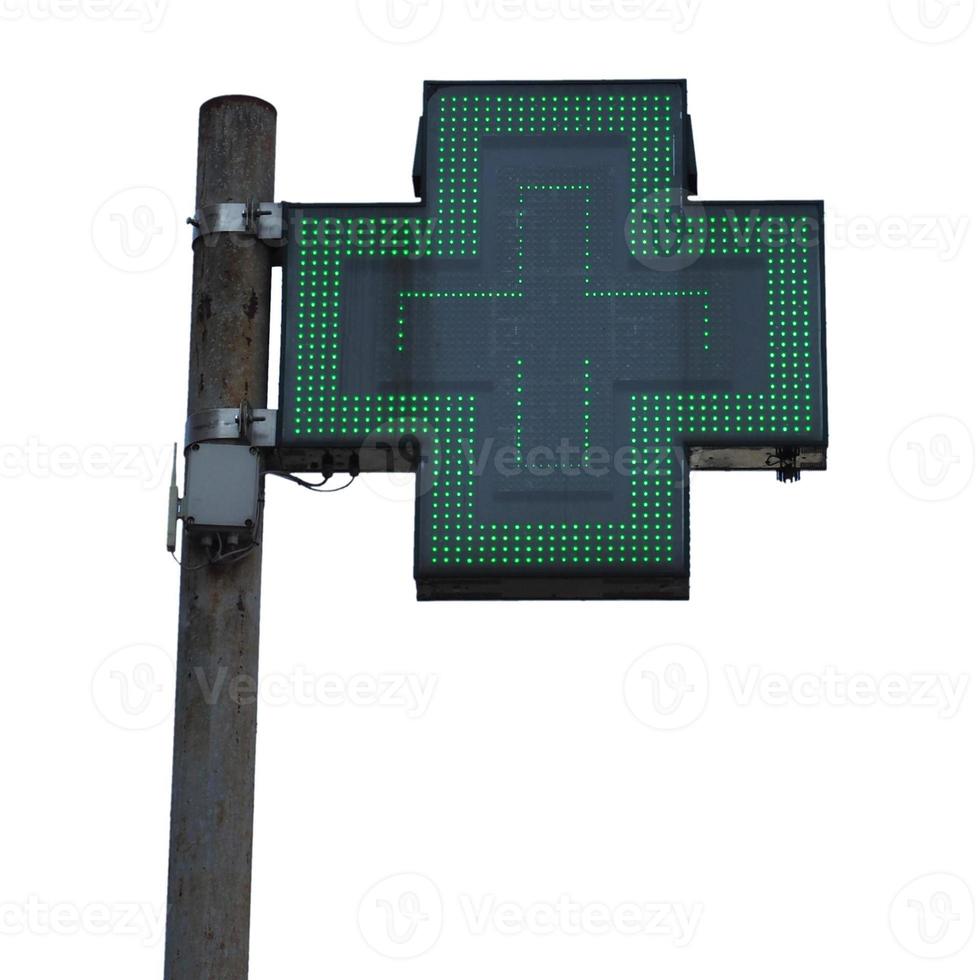 Green cross pharmacy sign, isolated over white photo