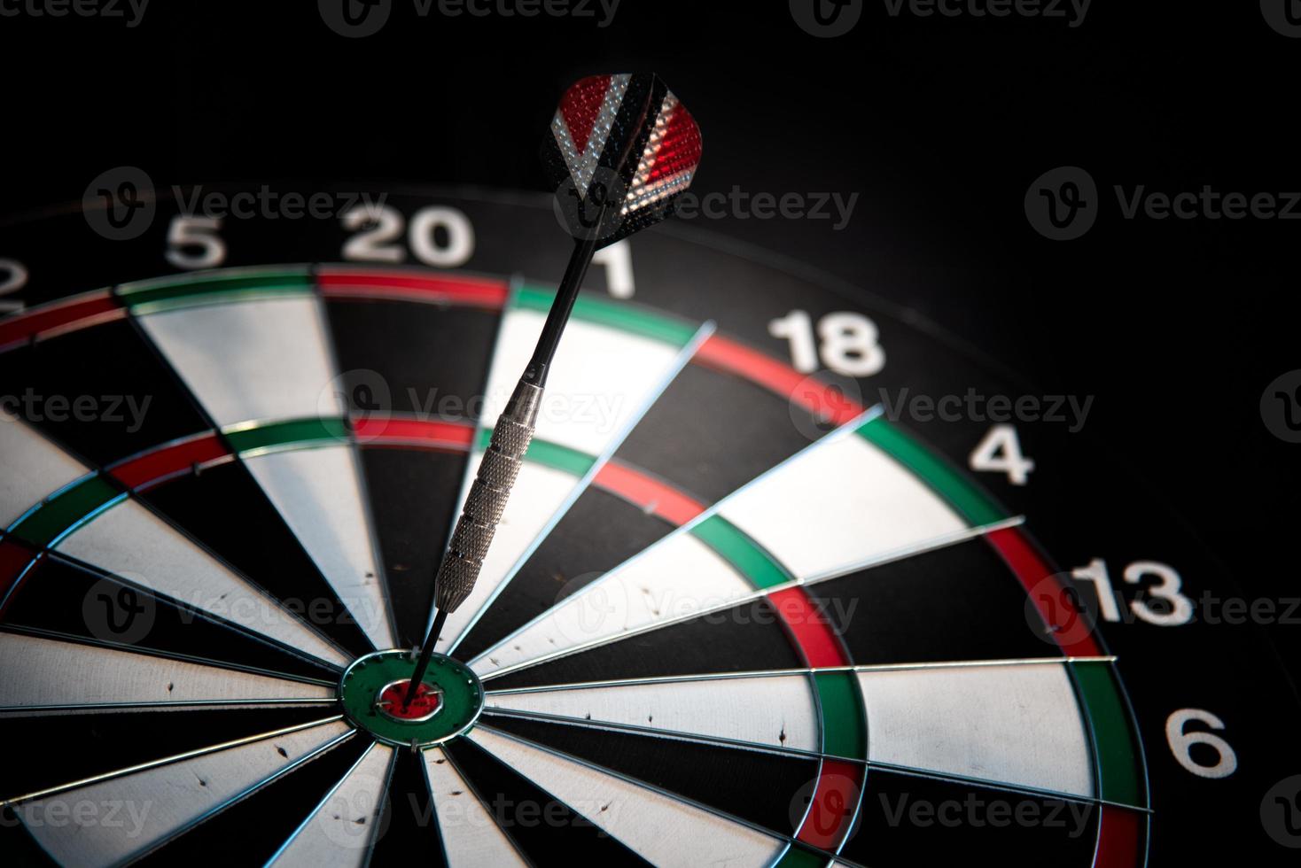 Darts arrows in center target. Business and leisure concept photo