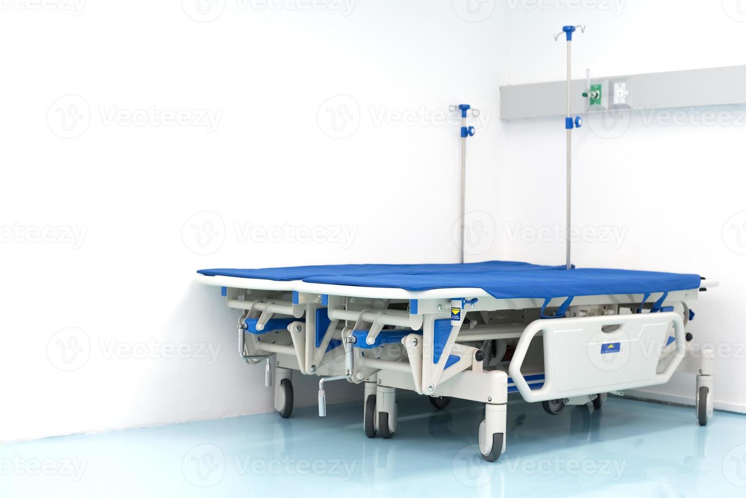 Two hospital bed on the room corner. Hospital and emergency room photo