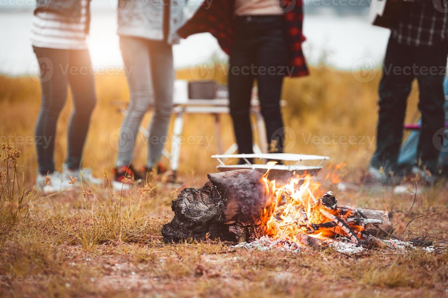 Closeup of campfire with friendship dancing to beat of the music photo