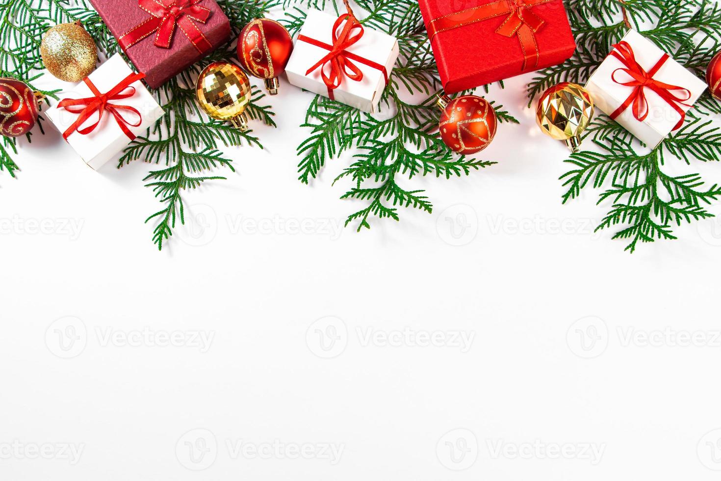 Beautiful Christmas balls and gifts on white background. photo