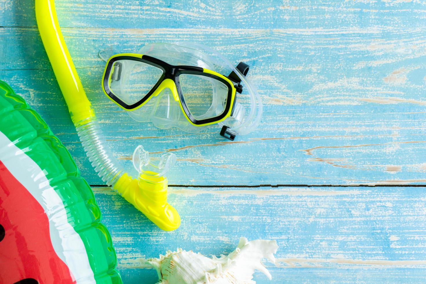 Flat lay dive accessories on wooden table photo