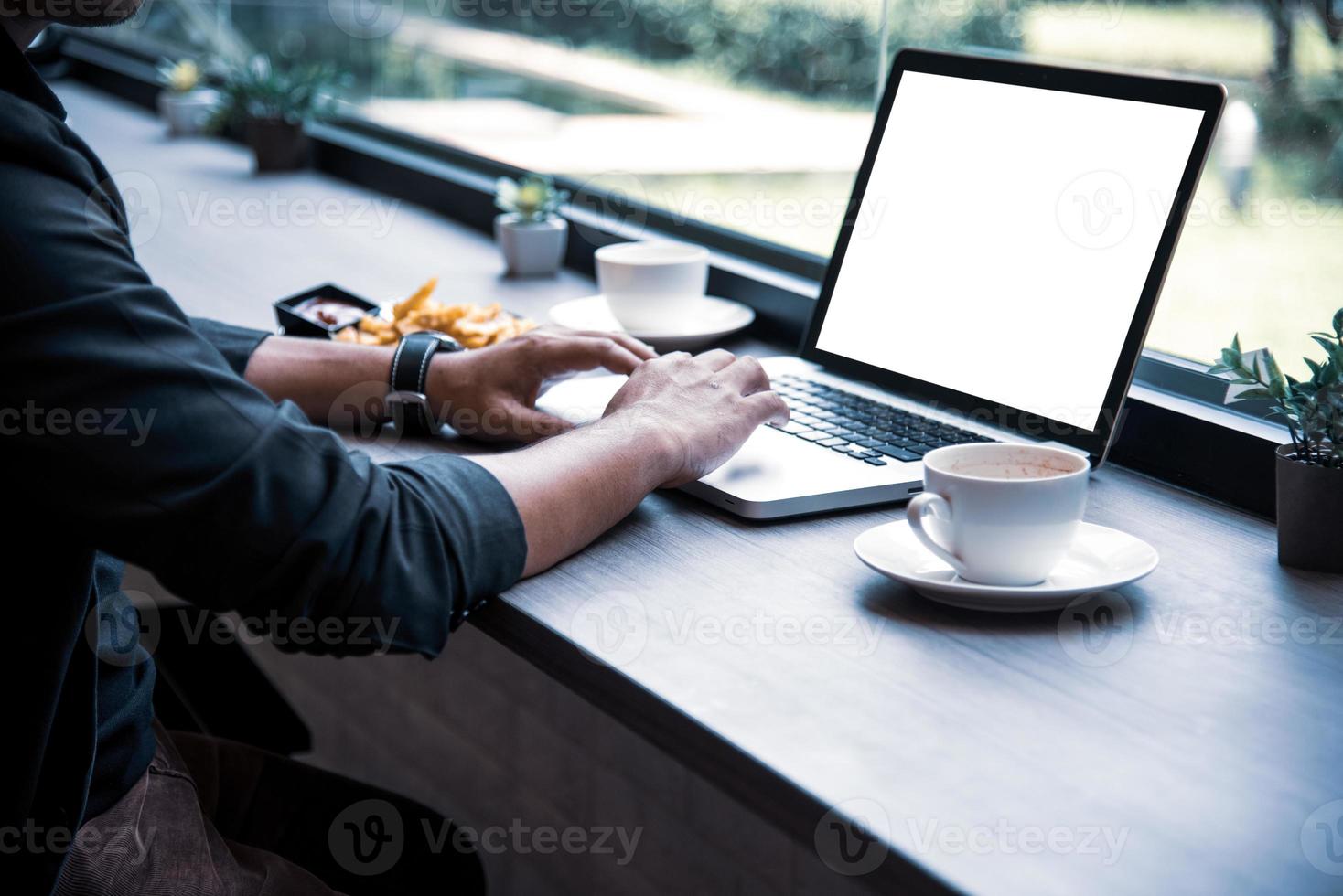 Side view of businessman using the laptop photo