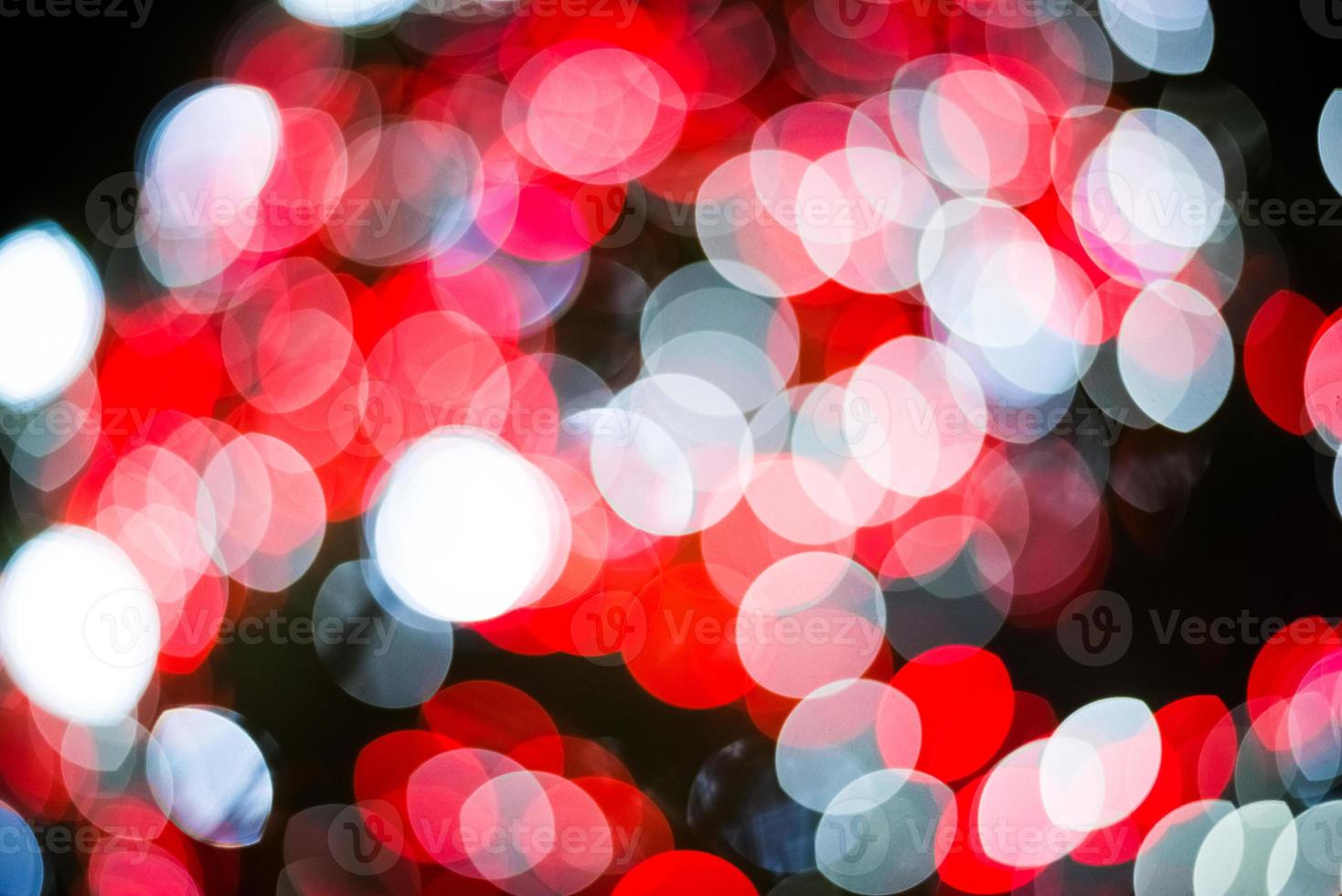 Red and white abstract blurry light bokeh background photo