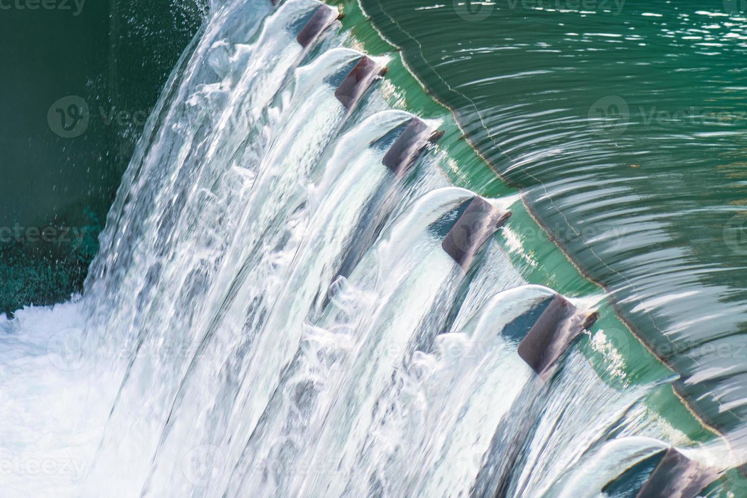 Detail of a dam with flowing water photo