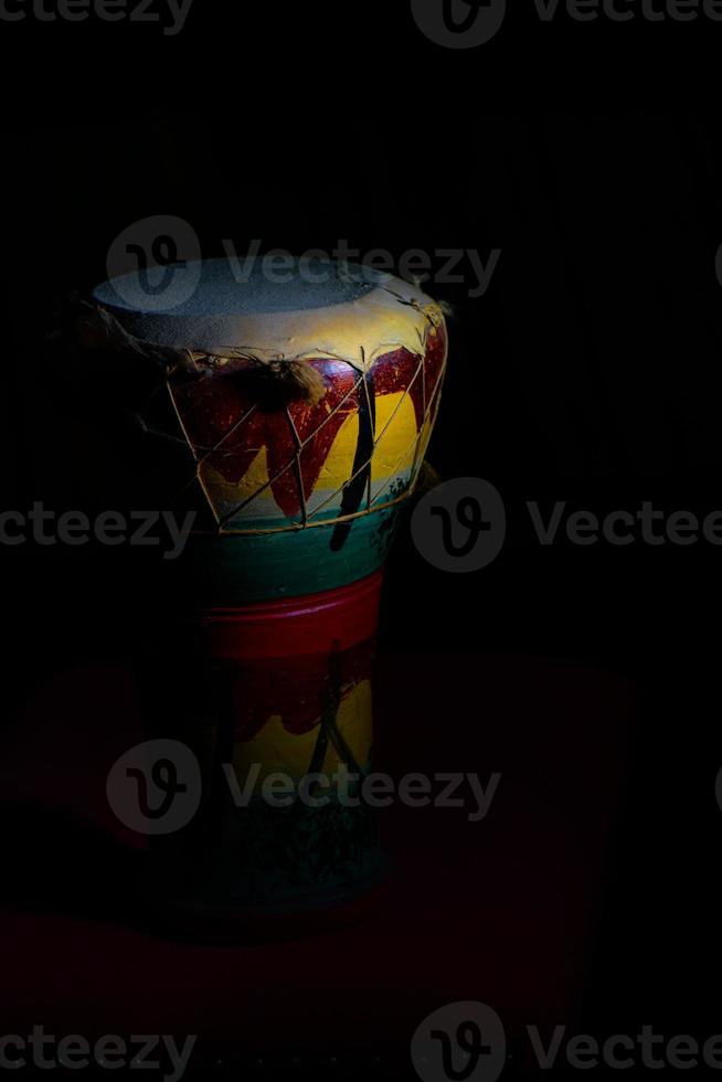 Percussion of African leather and ceramic on a black background photo