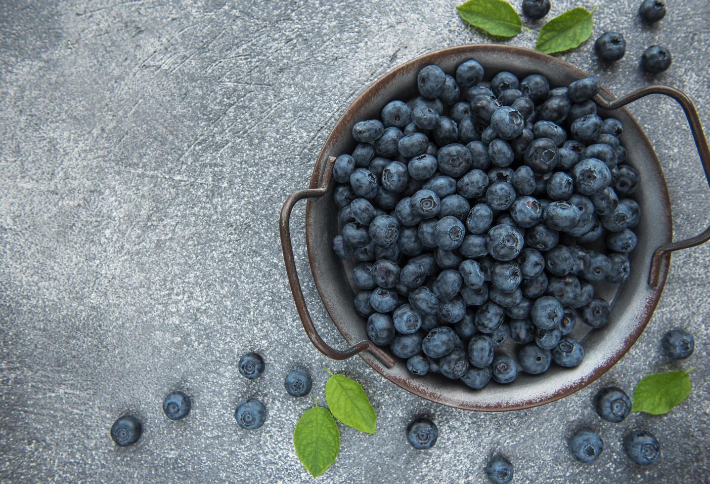 Blueberries on concrete background photo