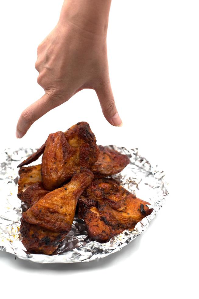 Hand catching roasted wing photo