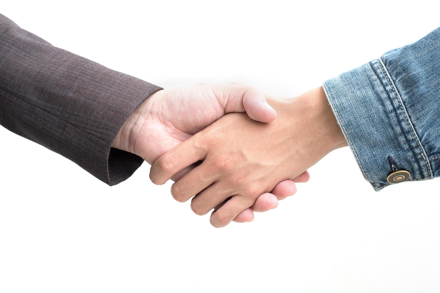 Hands shake of businessmen on isolated white background photo