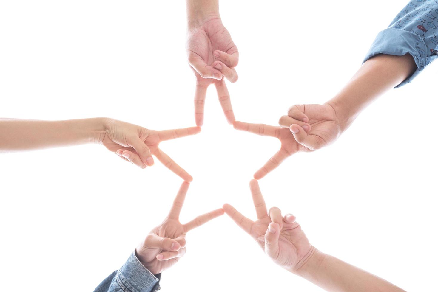 Hands in form as star shape on isolated white background photo