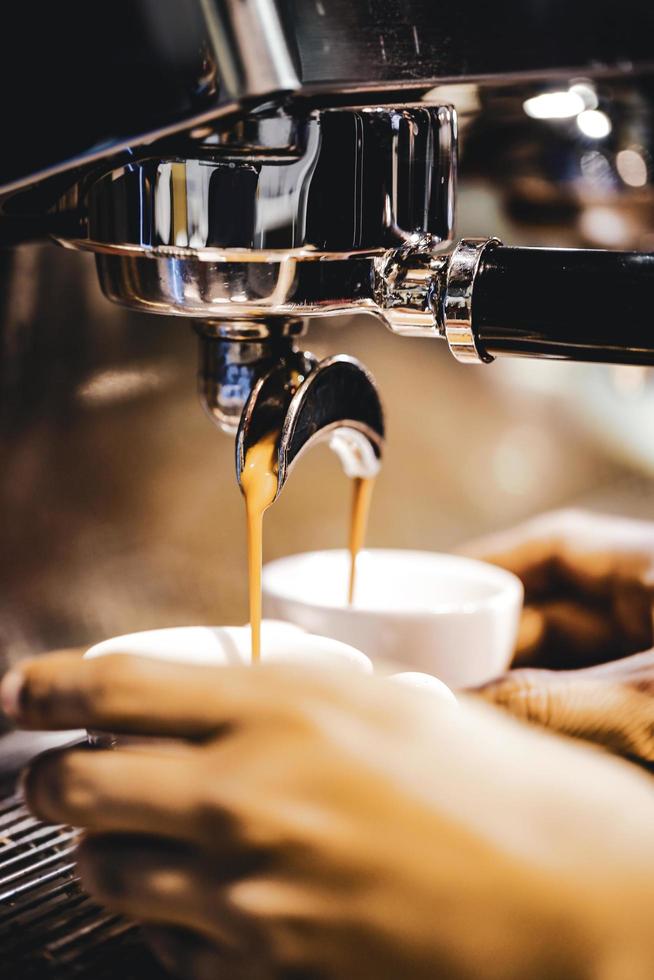 Espresso machine brewing a coffee photo