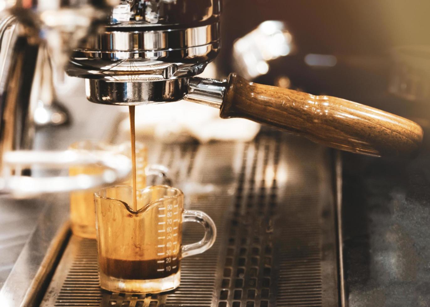 Espresso machine brewing a coffee photo