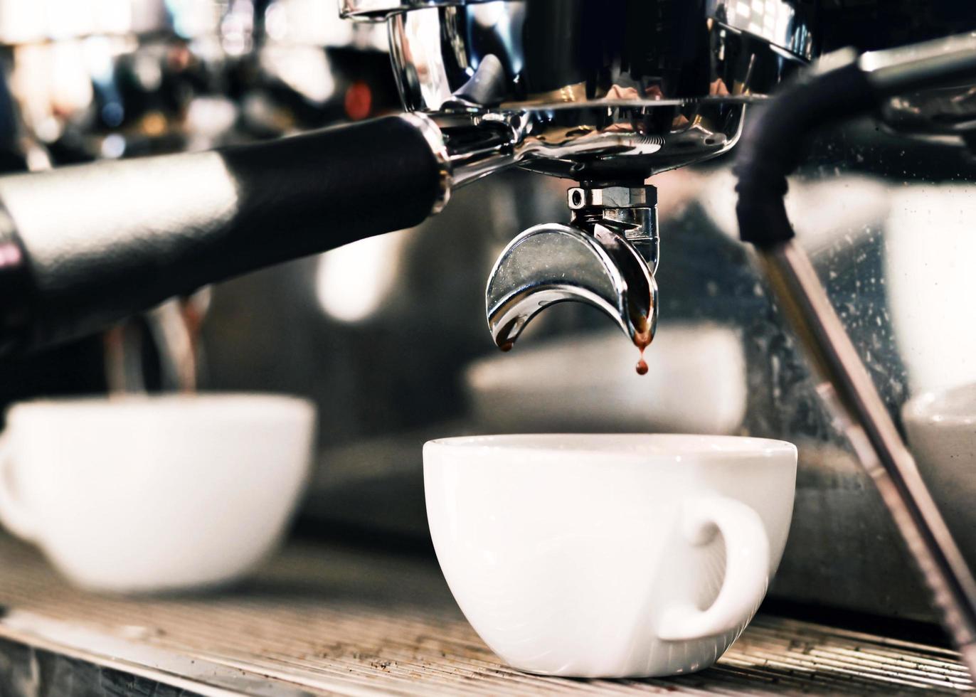 Espresso machine brewing a coffee photo