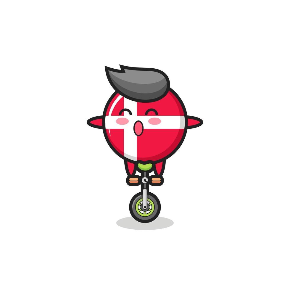 The cute denmark flag badge character is riding a circus bike vector
