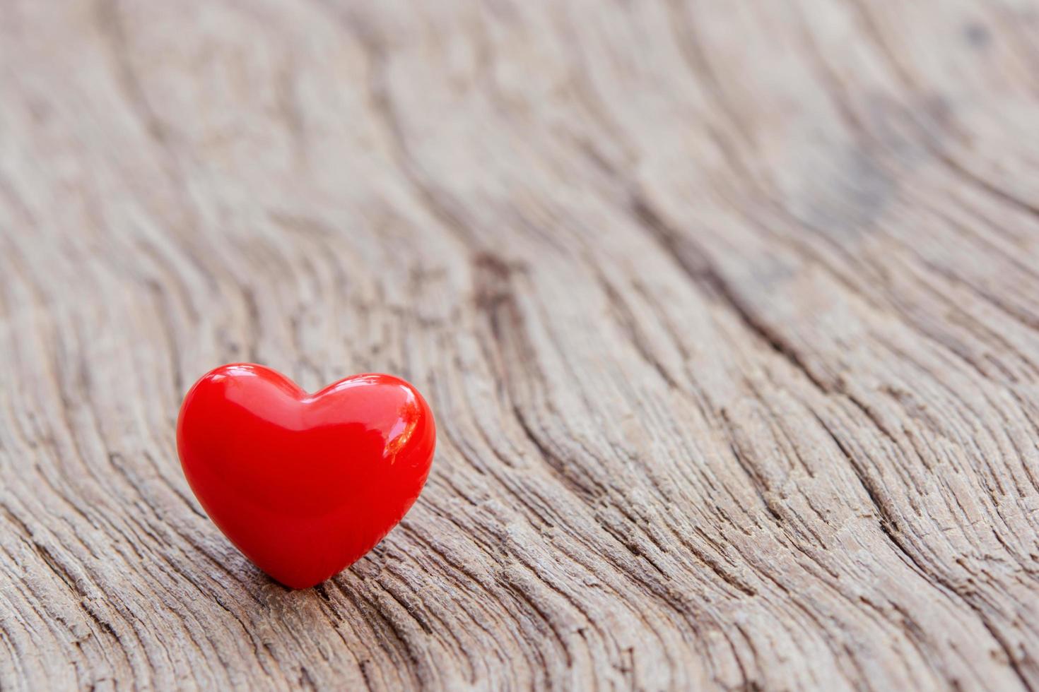 Valentines Day background with red hearts on plank wooden, copy space photo