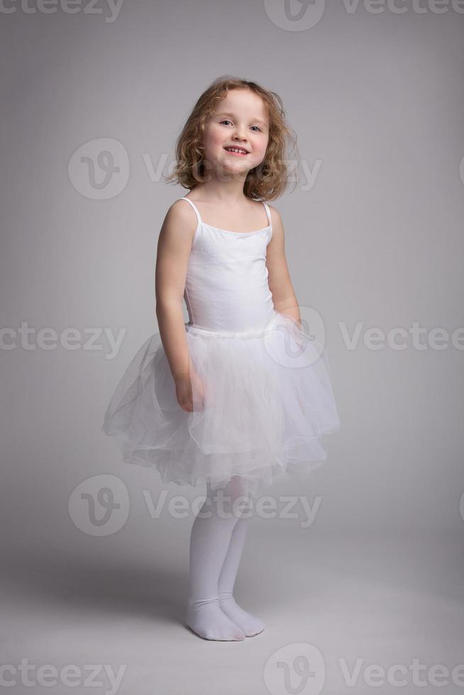 Little blond girl in a ballet dress photo