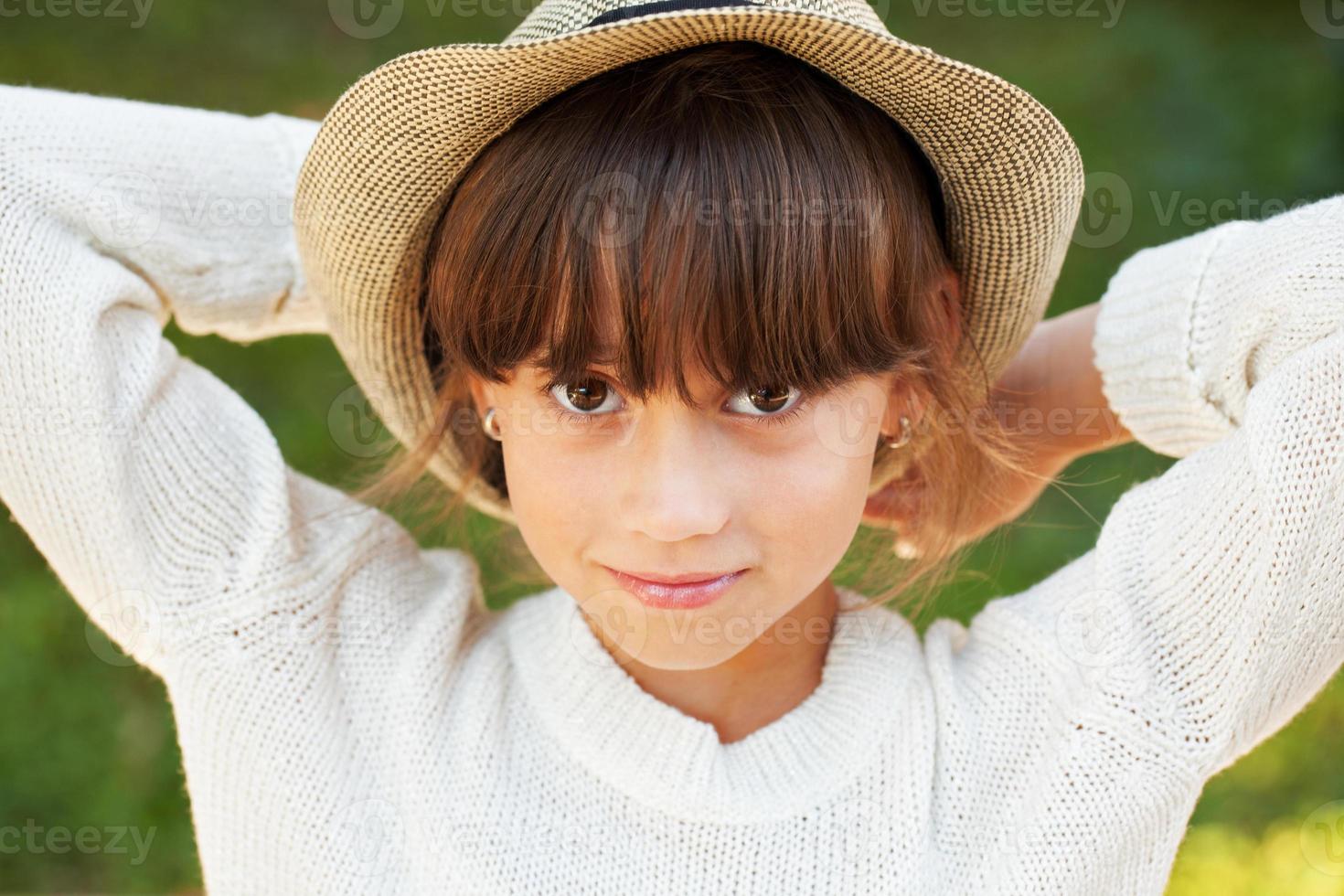 Beautiful brown-eyed girl in stylish hat photo