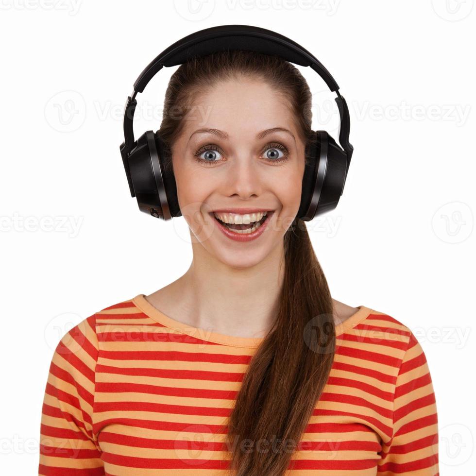 Cheerful young woman with stereo headphones photo