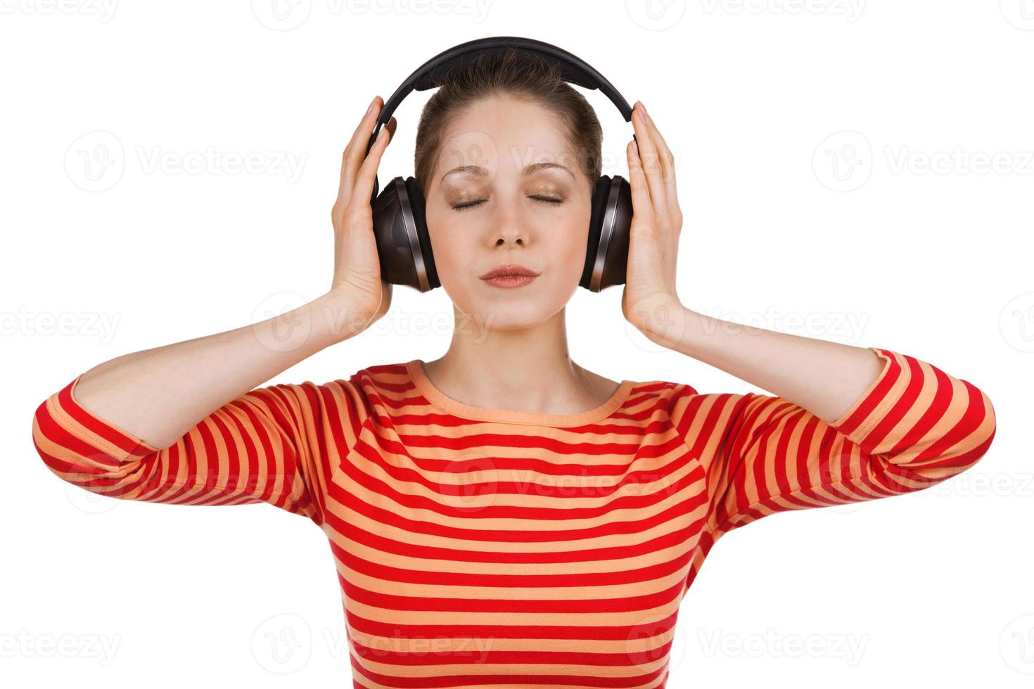 Girl, eyes closed, listening to music photo