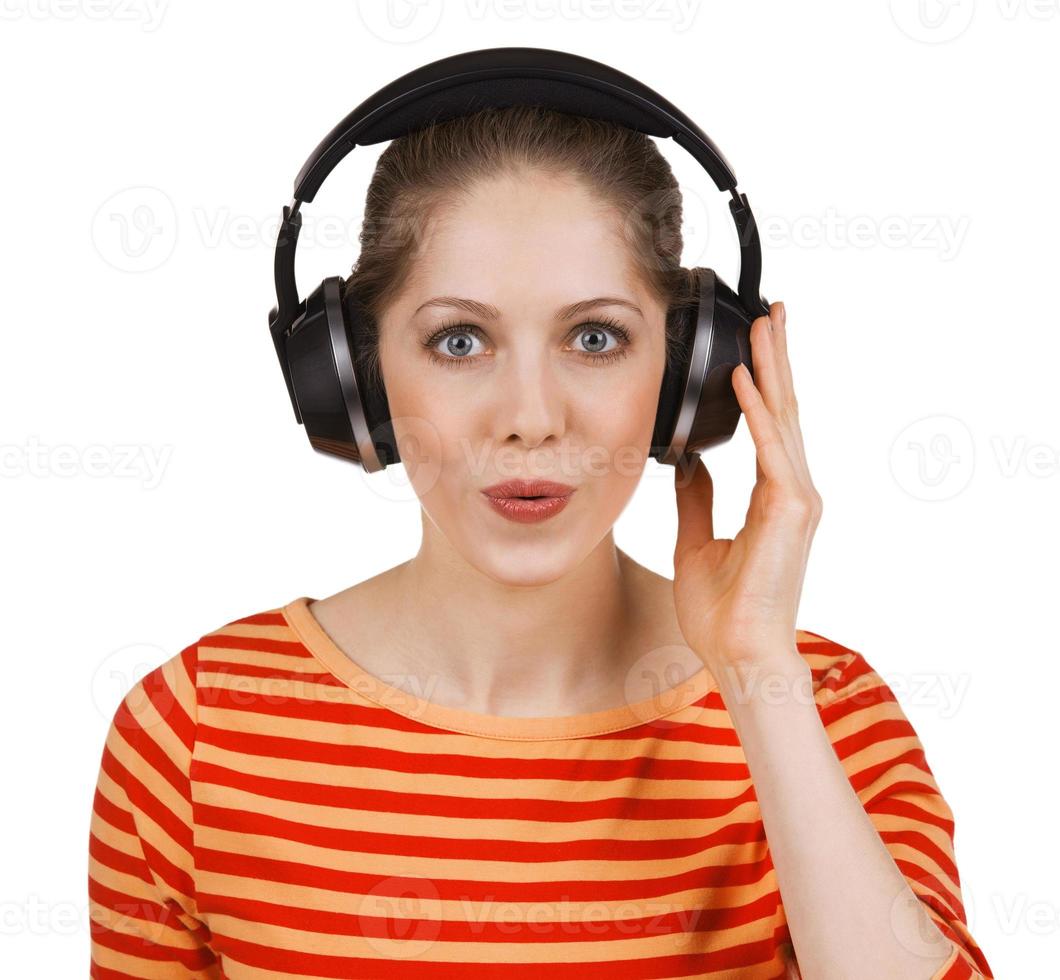 Cheerful girl listening to music on headphones photo