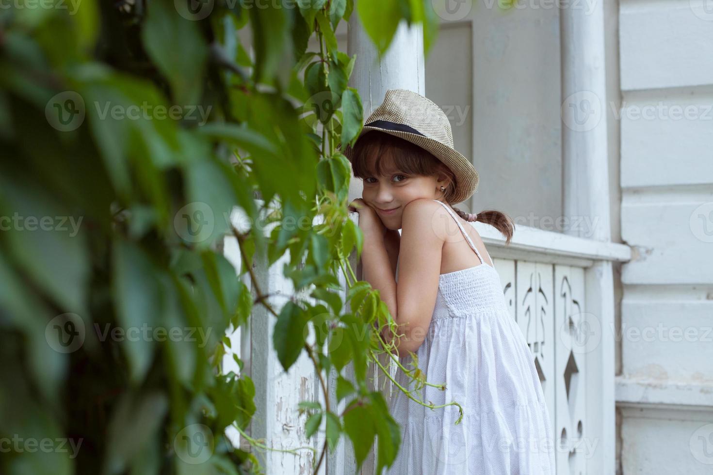 Charming girl in a hat photo