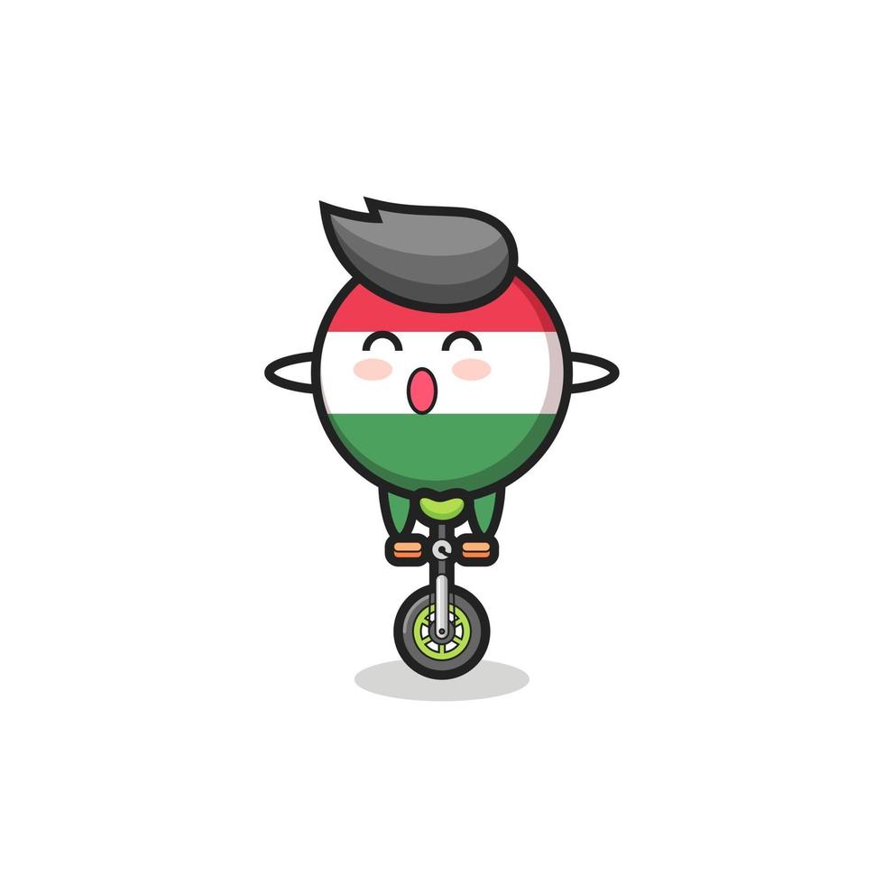The cute hungary flag badge character is riding a circus bike vector