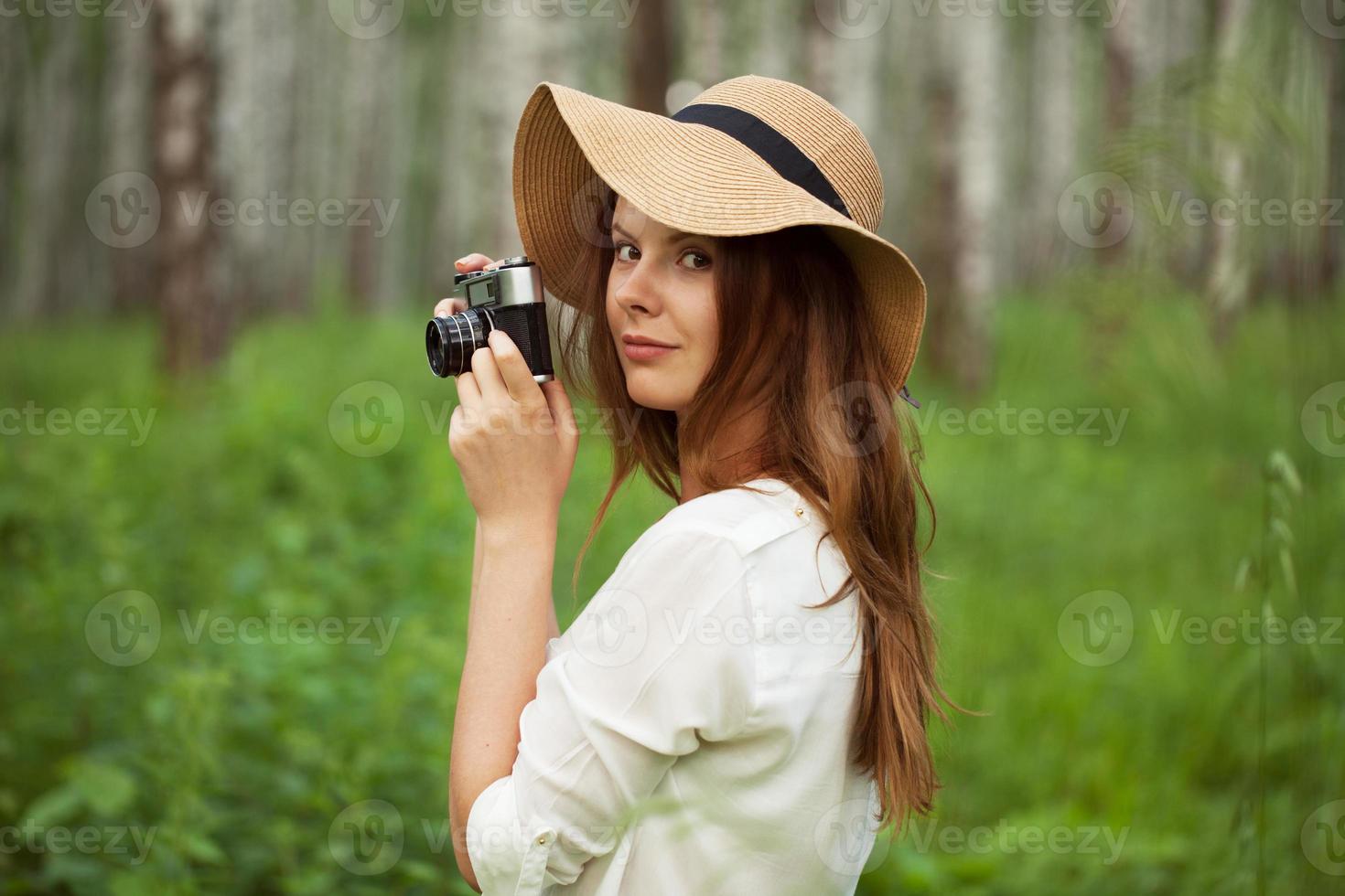 hermosa chica con una camara foto