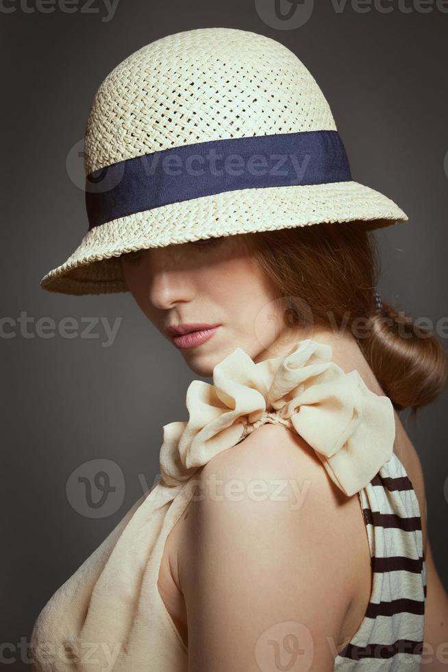 Stylish woman in retro wicker hat photo