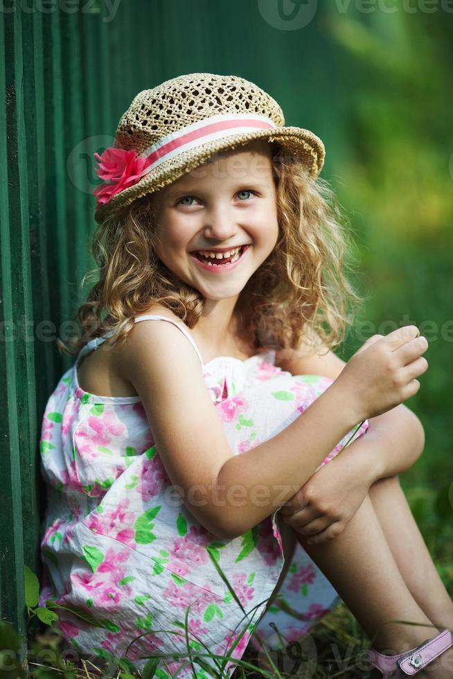 Happy little girl cheerfully laughs photo