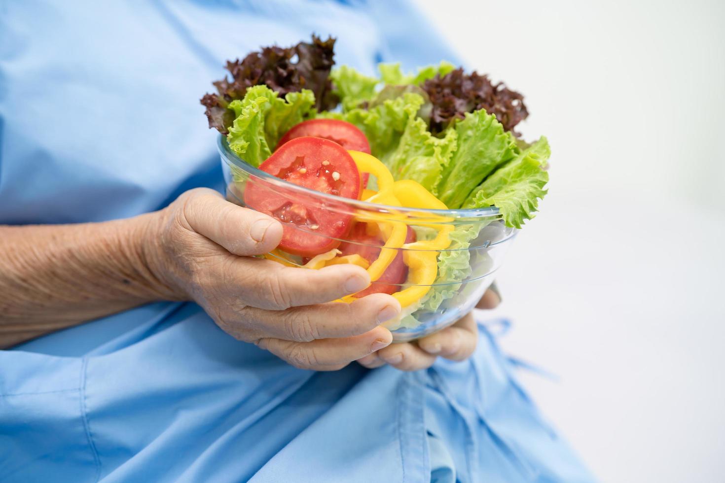 Asian senior woman patient eating breakfast photo