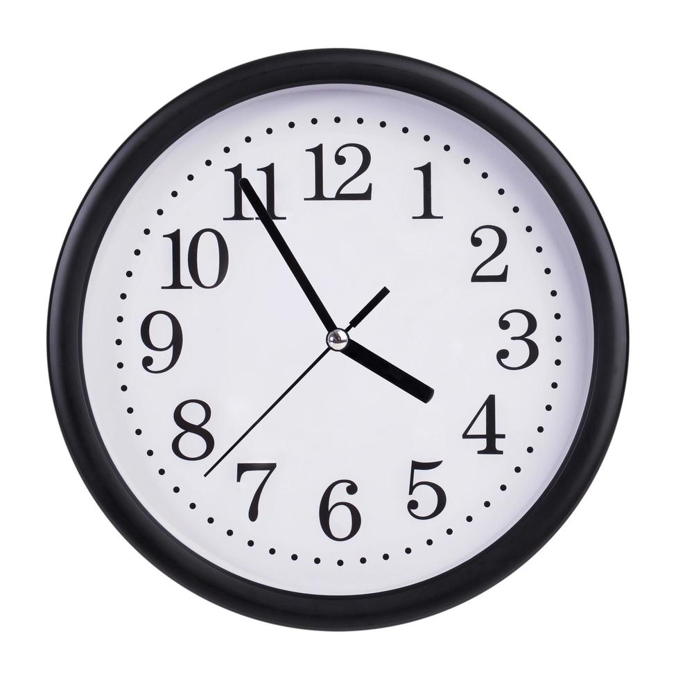 Office clock shows five minutes to four photo