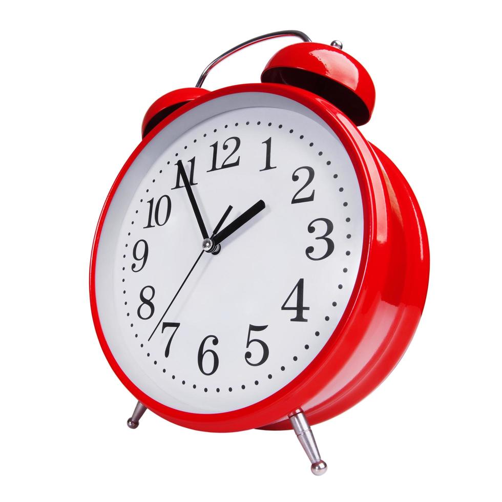 Red alarm clock on white background photo