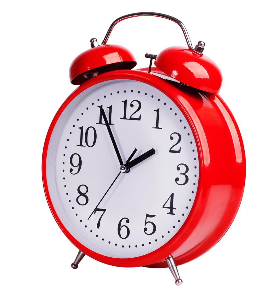 Red alarm clock on white background photo