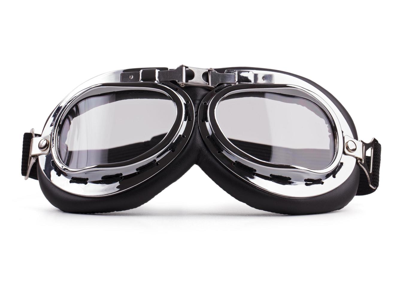 Motorcycle safety glasses on white background photo