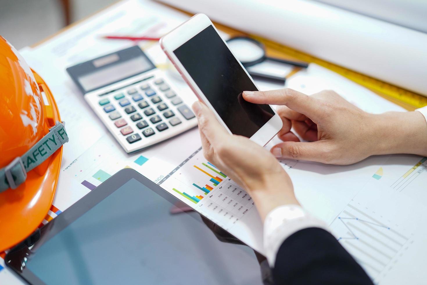 Asian accountant working and analyzing financial graph reports photo