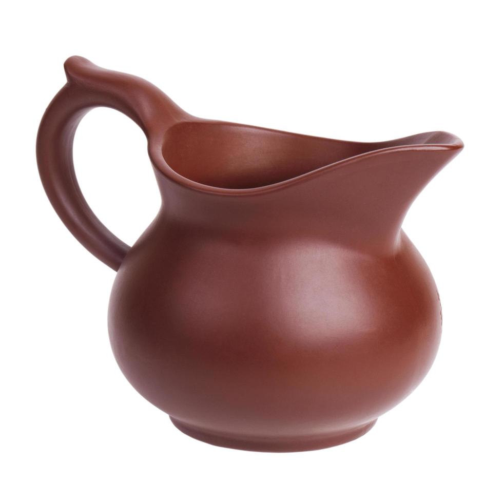 Clay jug on a white background photo