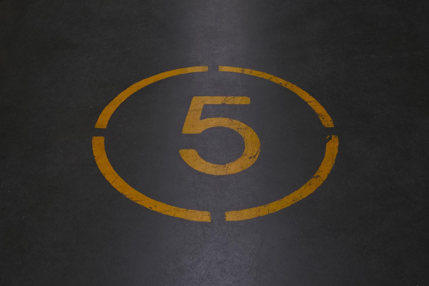 Number five is written with yellow paint photo