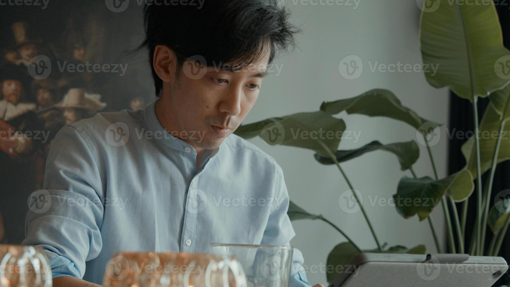 Man using laptop at table photo