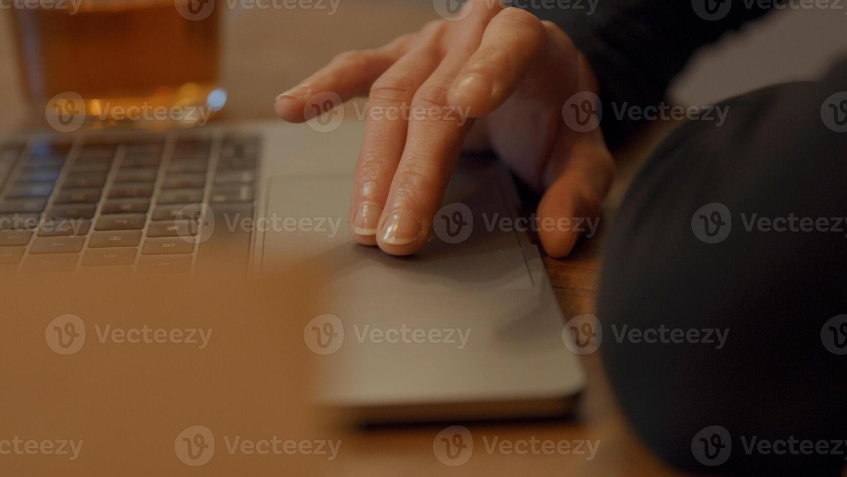 Fingers of woman scrolling on touchpad photo