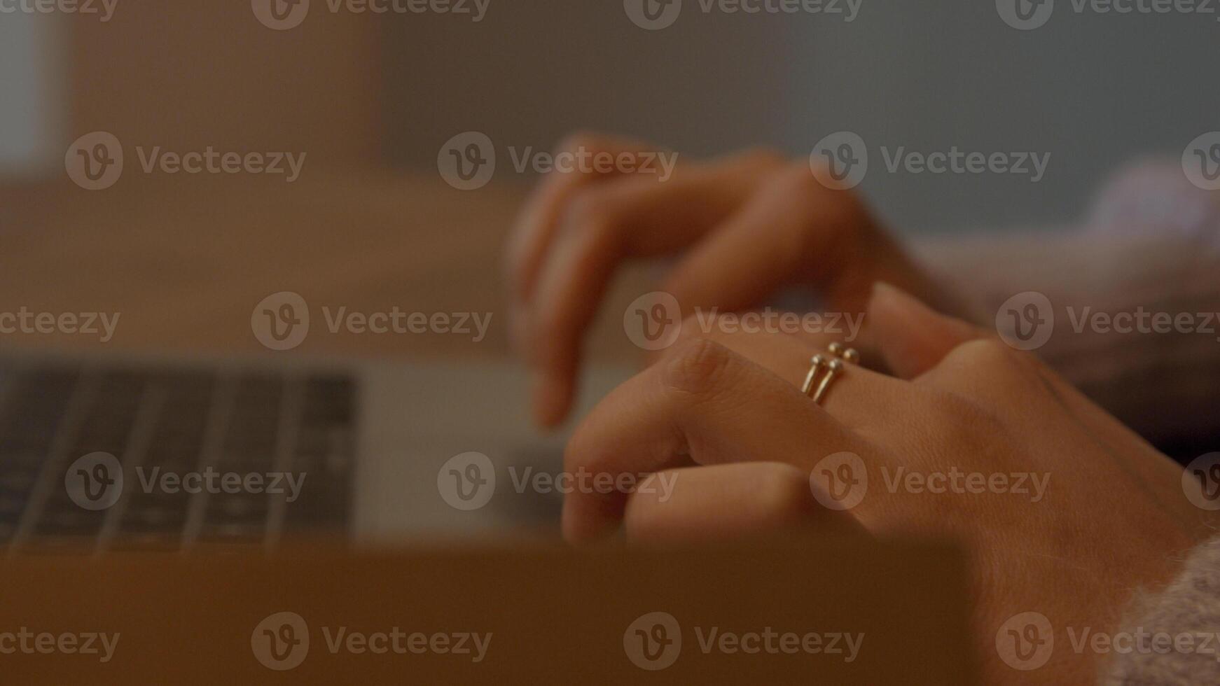 Hands of woman scrolling on touch pad photo