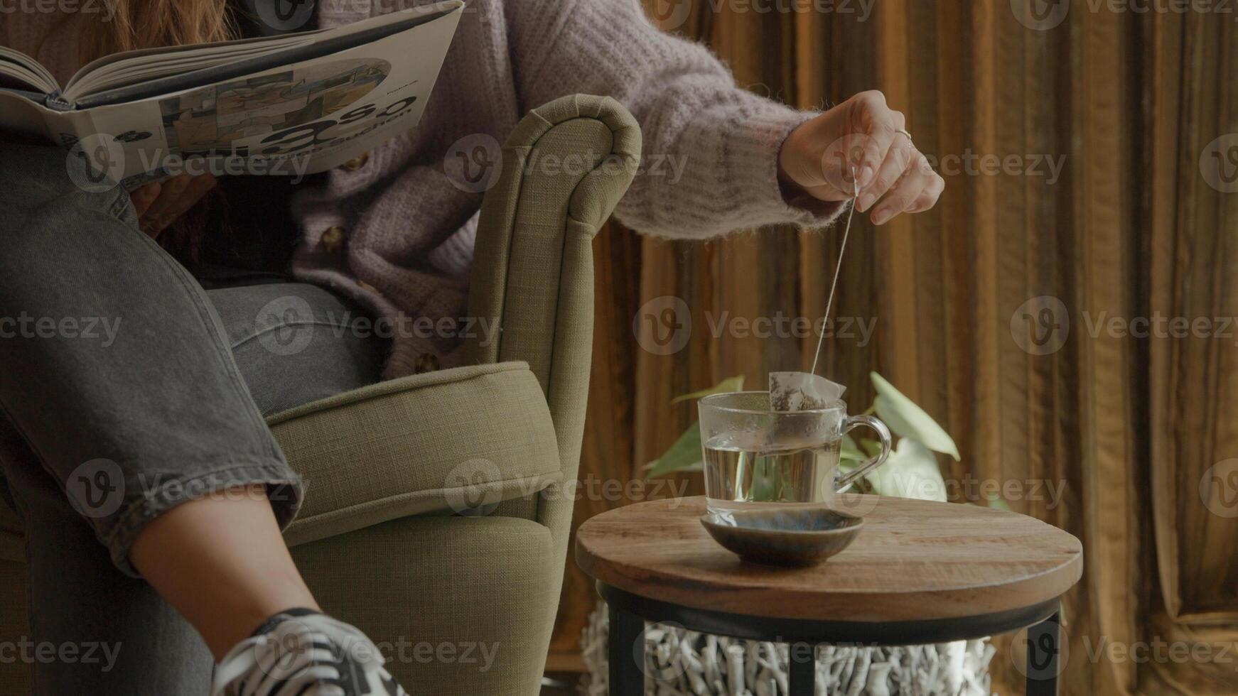 Person reading while having tea photo