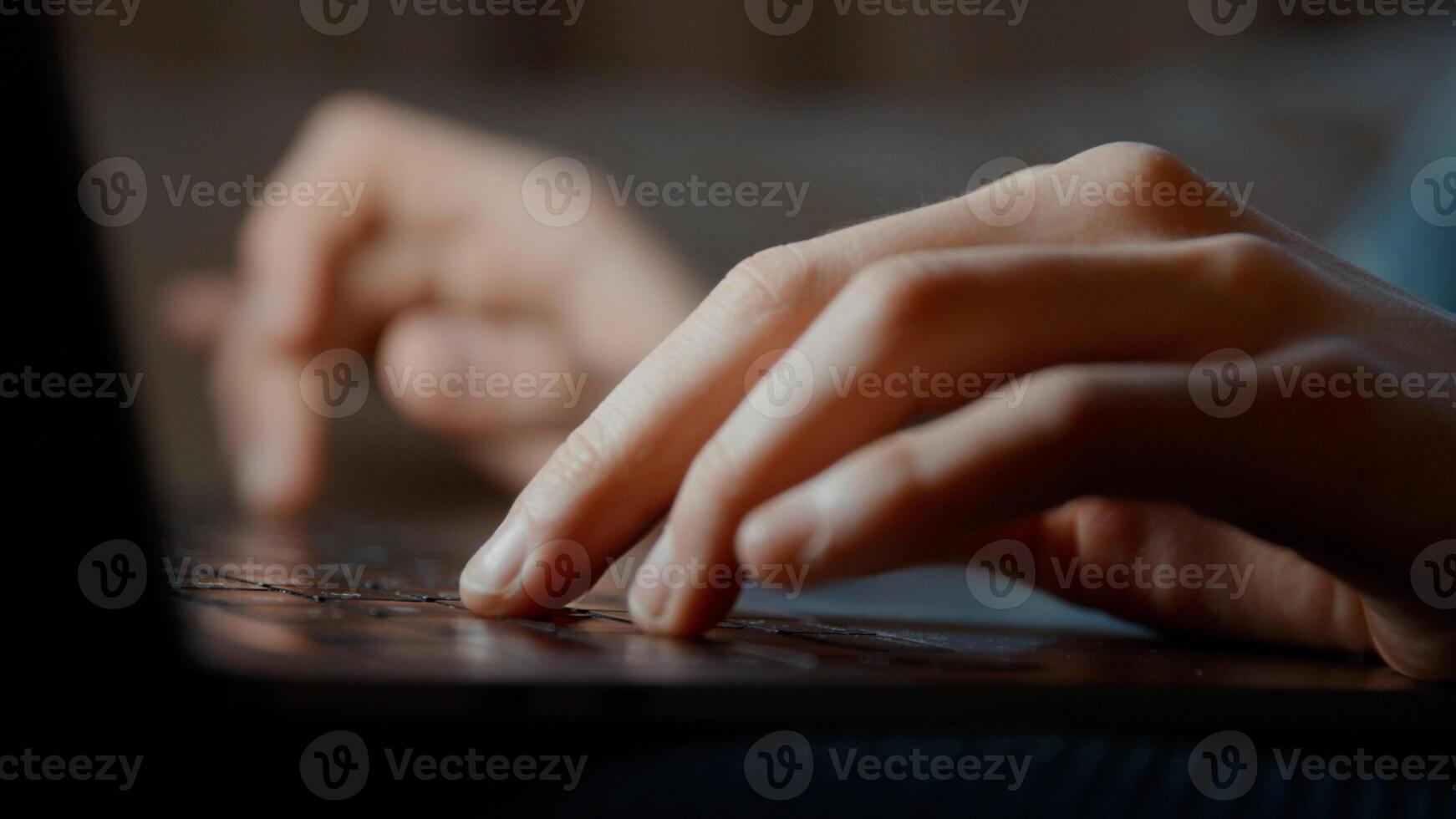 Woman laughing with laptop on lap photo