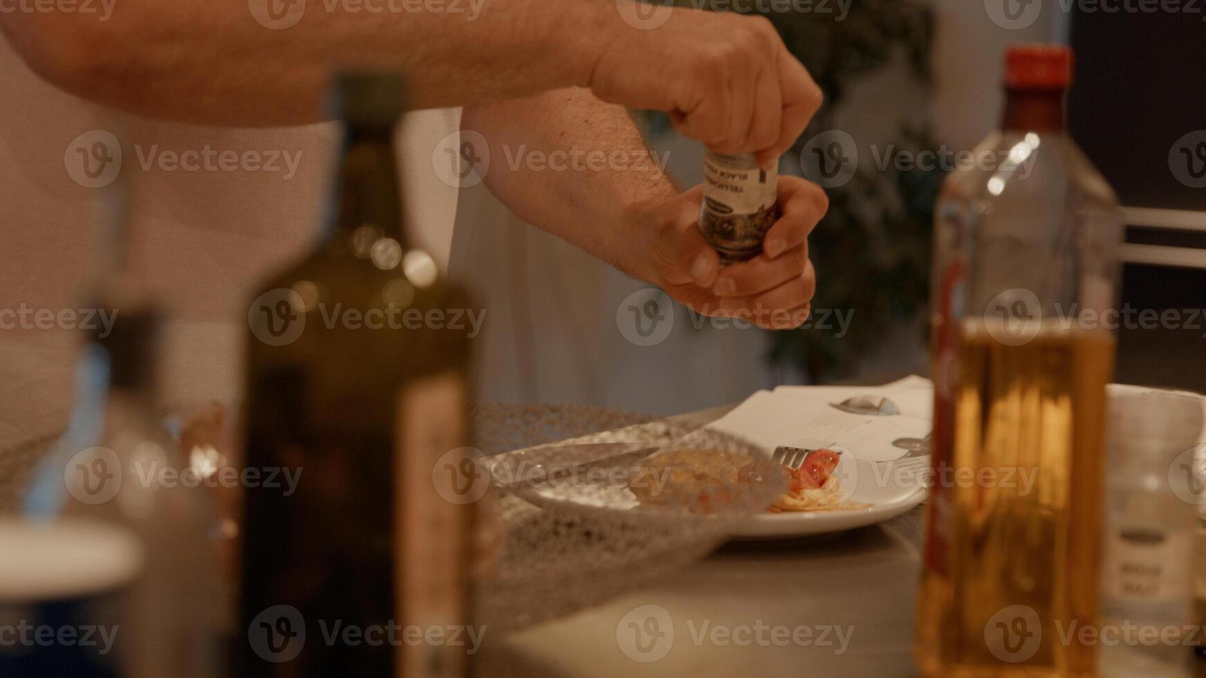 Hands of two women taking popcorn out of bowl photo