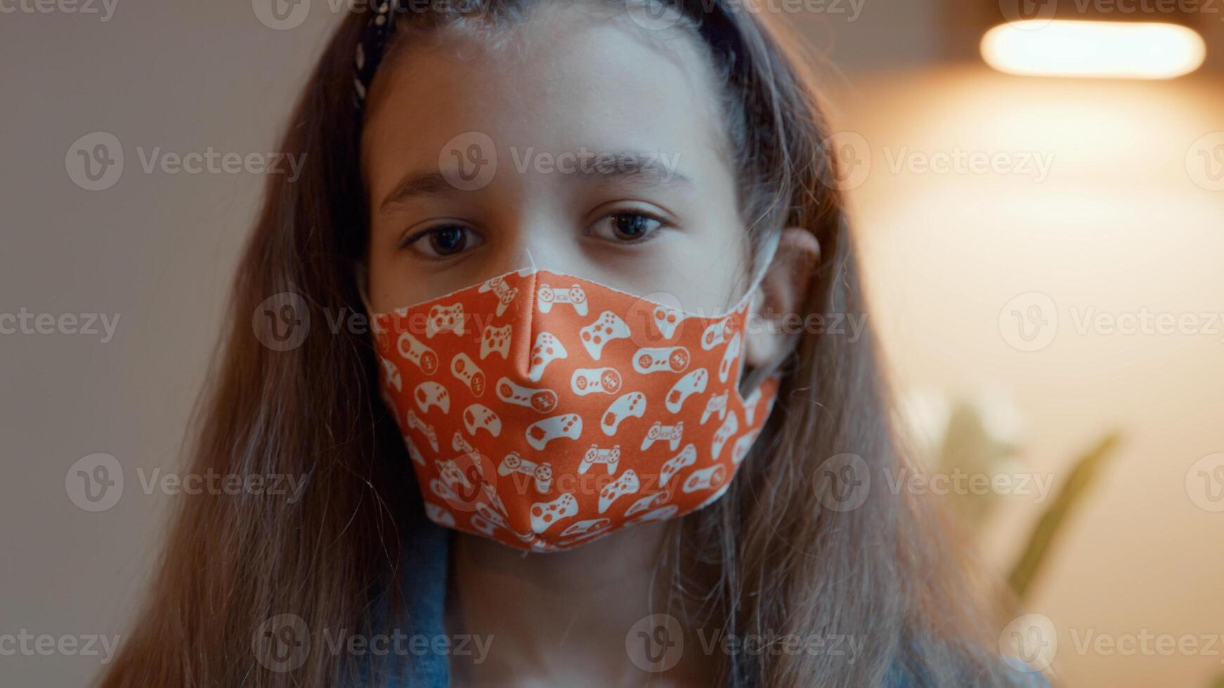 Girl putting on face mask photo