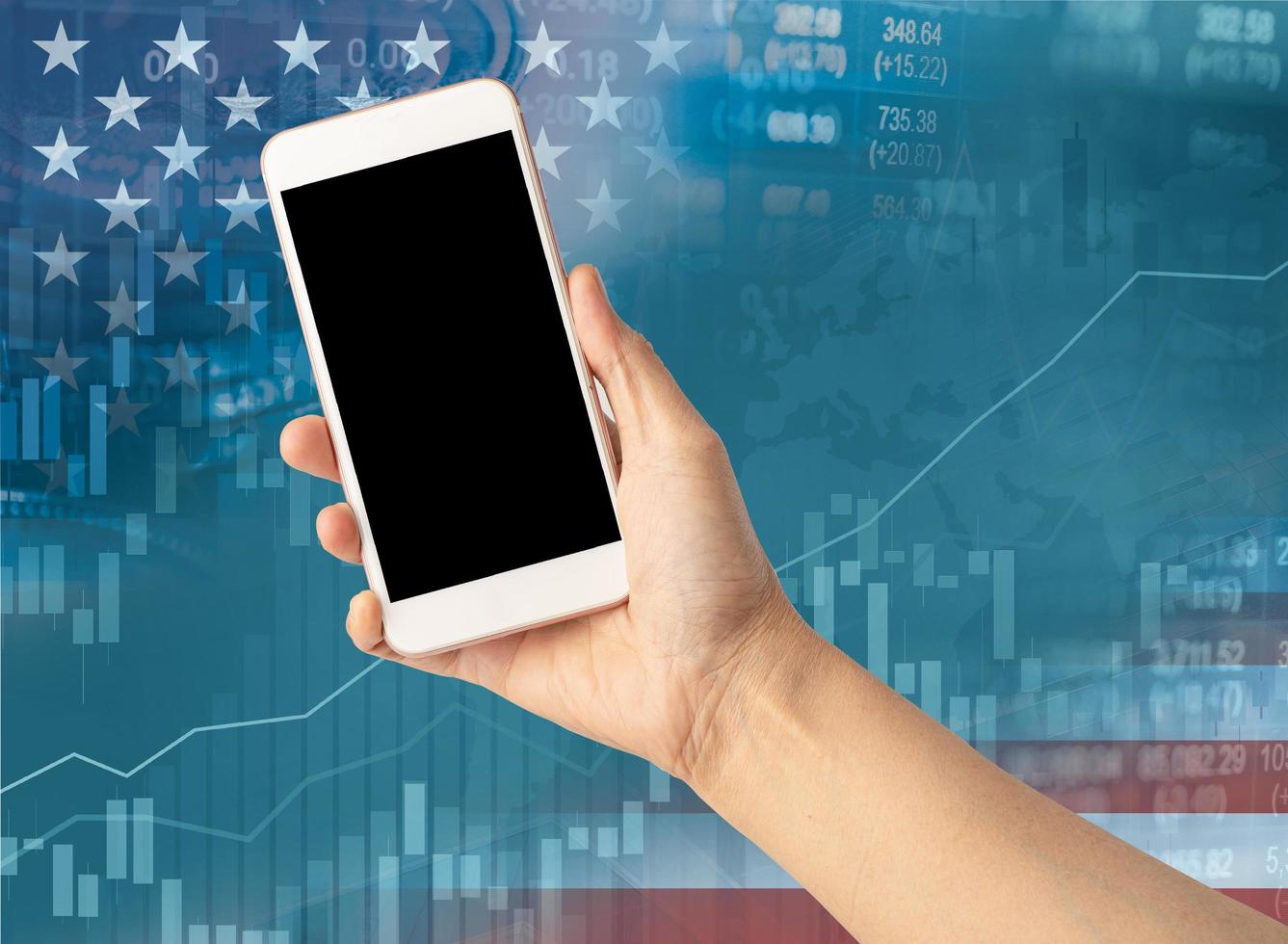 Holding mobile phone to online trade finance with America flag photo