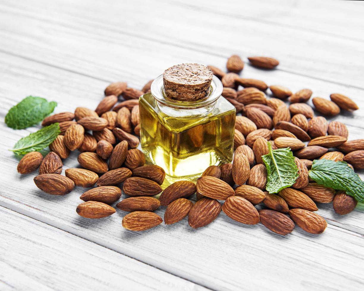 Almond oil and  almonds photo